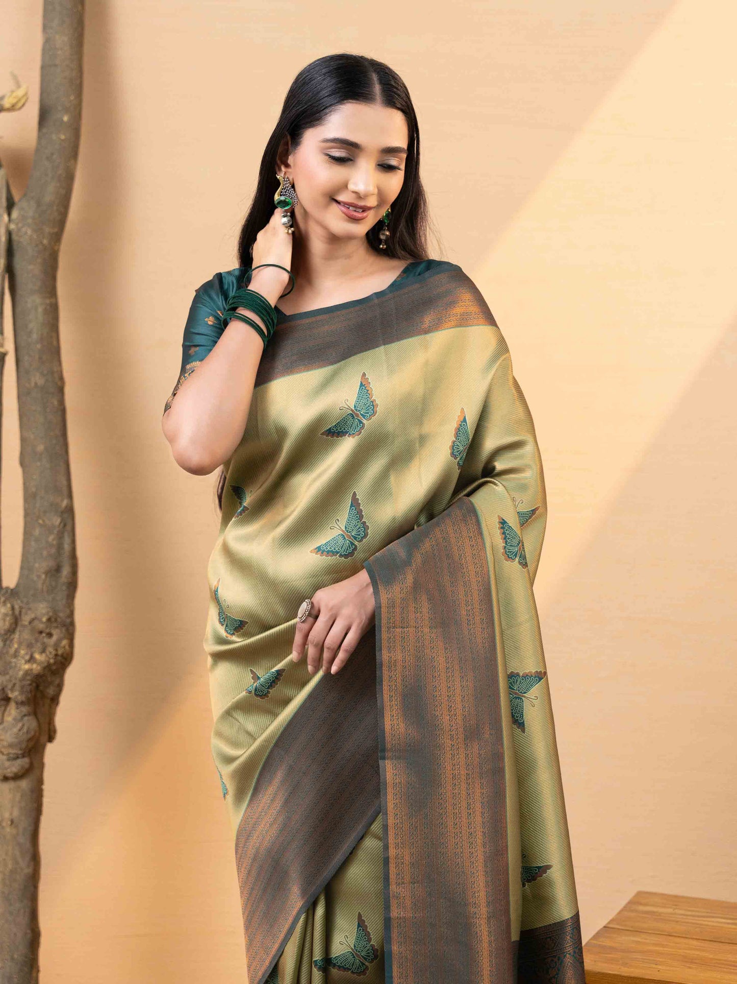Luxurious Olive Gold and Teal Tissue Silk Saree