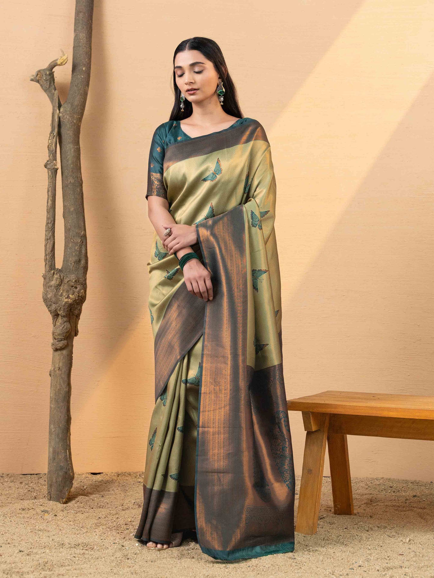 Luxurious Olive Gold and Teal Tissue Silk Saree