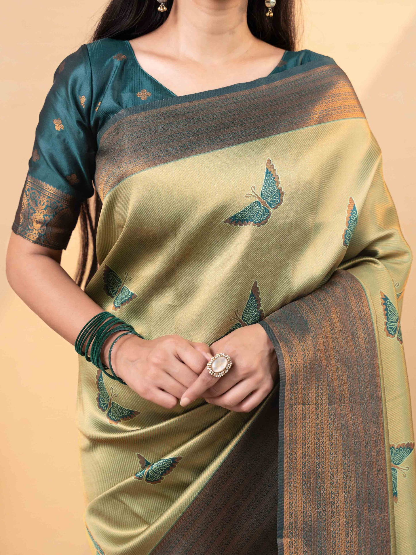 Luxurious Olive Gold and Teal Tissue Silk Saree