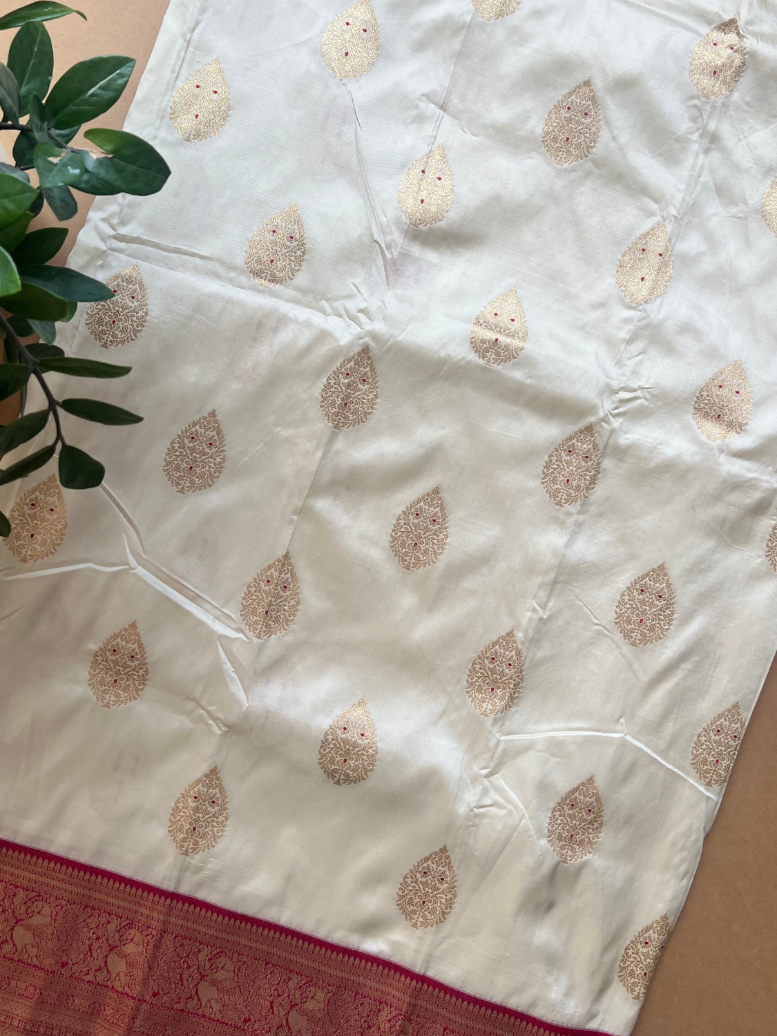 Cream Silk Woven Saree with Gold Buttas & Rich Rani Pink Zari Border